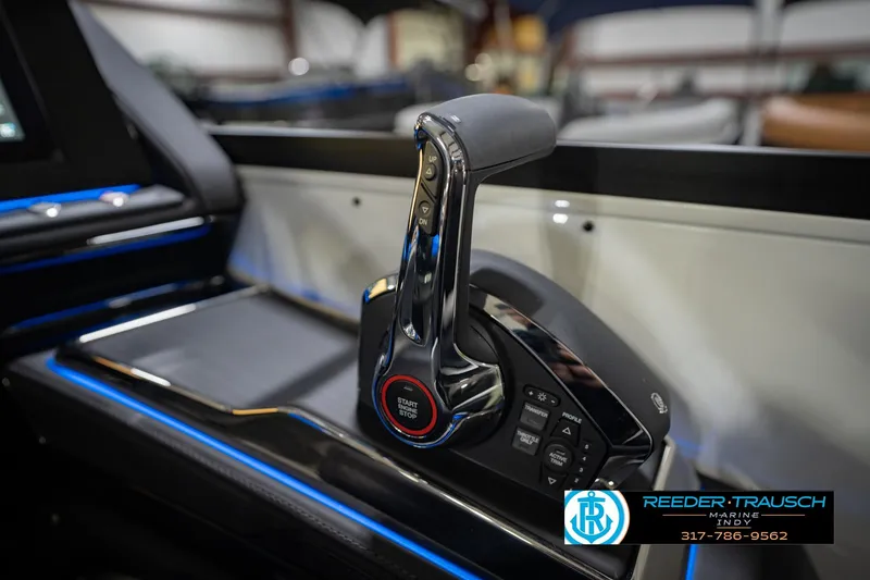 Slide: The Image of Throttle control of 2026 Bennington QX 25 QXFBA boat, featuring sleek design and start-stop button. - 34