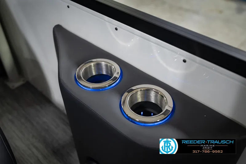 Slide: The Image of Illuminated cup holders in 2026 Bennington QX 25 QXFBA boat interior. - 43