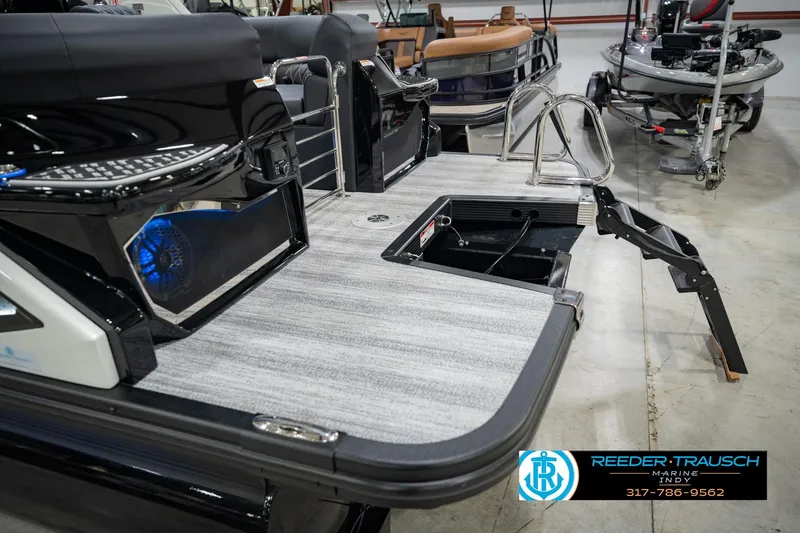 Slide: The Image of 2026 Bennington QX 25 QXFBA pontoon boat with sleek design and modern features. - 49