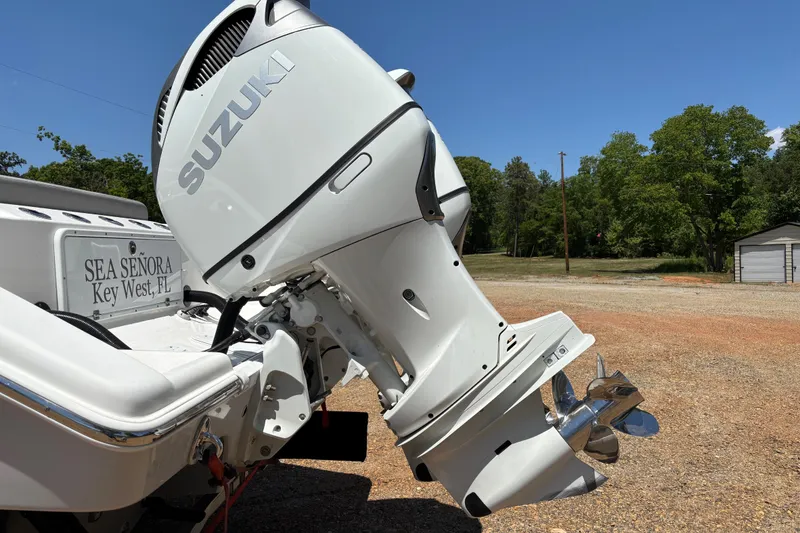 Slide: The Image of 2024 Sea Pro 322 Offshore boat interior with steering wheel and seating. - 16