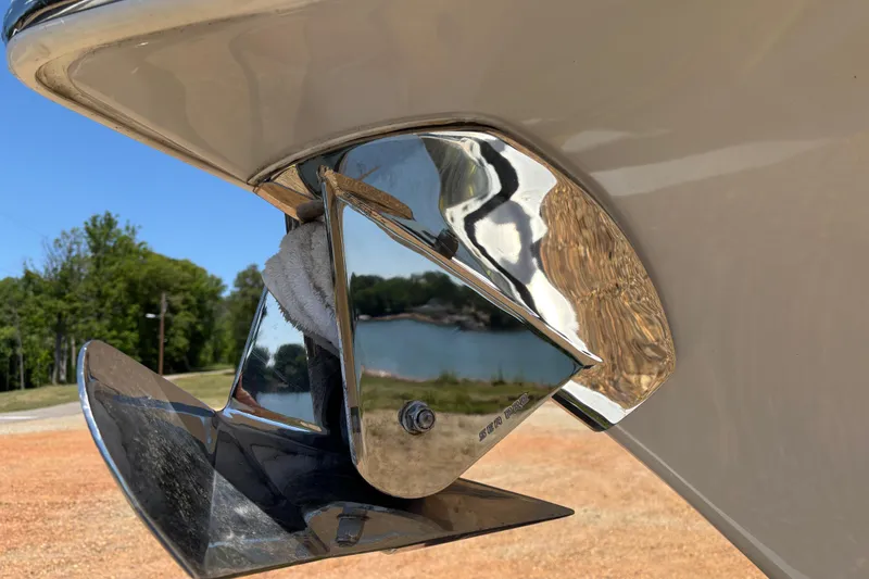 Slide: The Image of 2024 Sea Pro 322 Offshore boat with rod holders and speakers under a clear blue sky. - 17