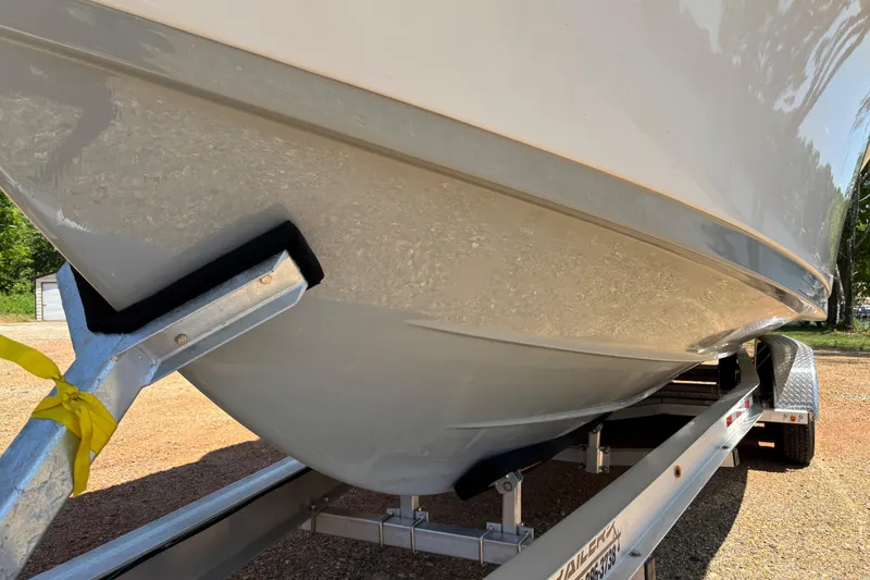 Slide: The Image of 2024 Sea Pro 322 Offshore boat interior with seating and storage compartments. - 18