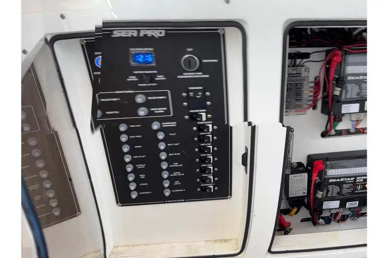 Slide: The Image of 2024 Sea Pro 322 Offshore boat interior with seating and table, featuring modern design elements. - 19