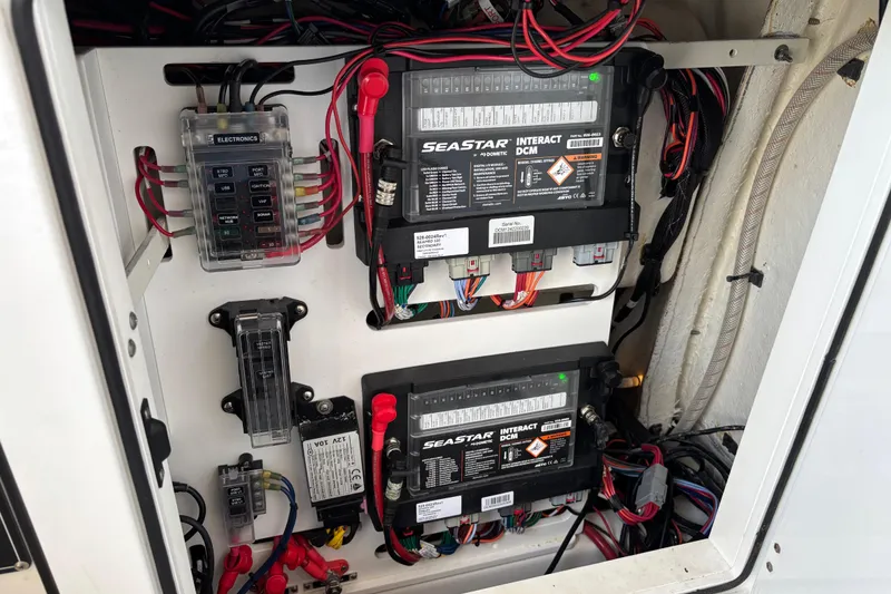 Slide: The Image of 2024 Sea Pro 322 Offshore boat interior with toilet, sink, and seating area. - 21