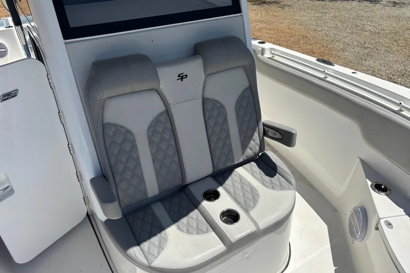 Slide: The Image of 2024 Sea Pro 322 Offshore boat seating with cup holders and quilted upholstery. - 22