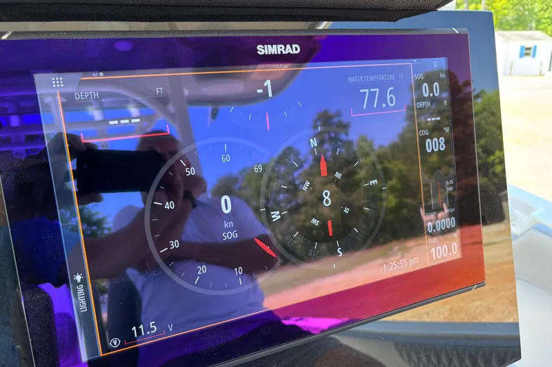 Slide: The Image of Simrad display on 2024 Sea Pro 322 Offshore showing navigation and water temperature. - 28