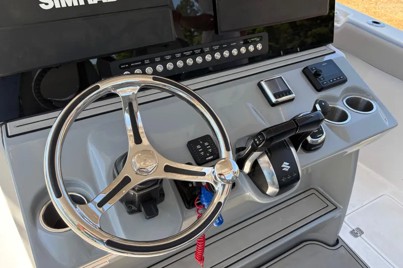 Slide: The Image of Steering console of 2024 Sea Pro 322 Offshore boat with modern controls and Simrad display. - 30