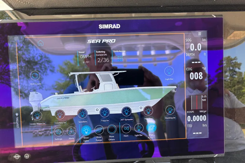 Slide: The Image of Simrad display showing 2024 Sea Pro 322 Offshore boat controls and navigation data. - 31