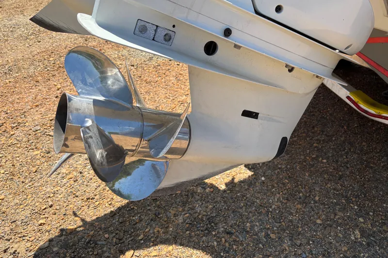 Slide: The Image of 2024 Sea Pro 322 Offshore boat propeller on gravel surface. - 6