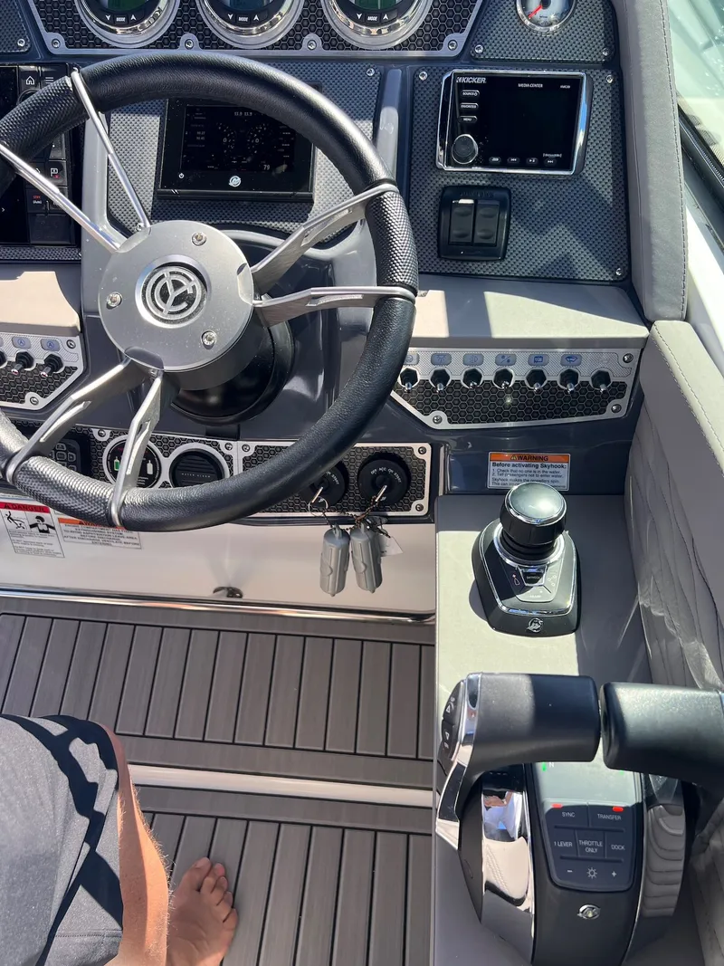 Slide: The Image of 2019 Cruisers Yachts 338 CX South Beach Bow Rider helm console. - 10