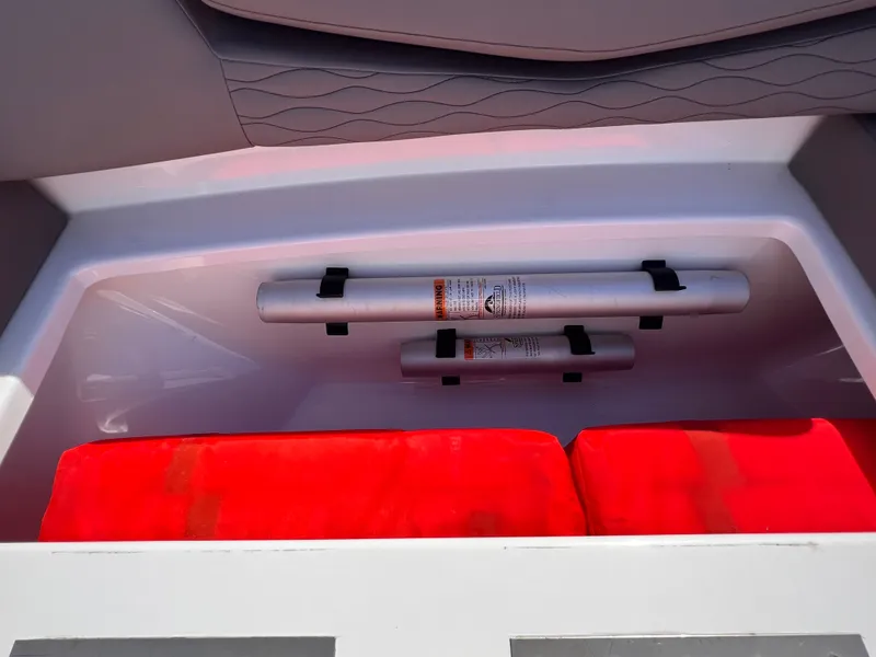 Slide: The Image of 2019 Cruisers Yachts 338 CX storage compartment with safety equipment. - 20