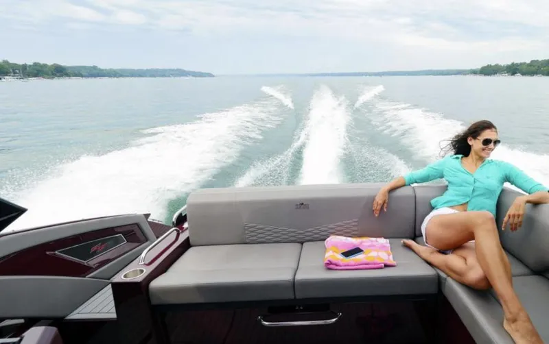 Slide: The Image of Woman relaxing on 2019 Cruisers Yachts 338 CX boat. - 3