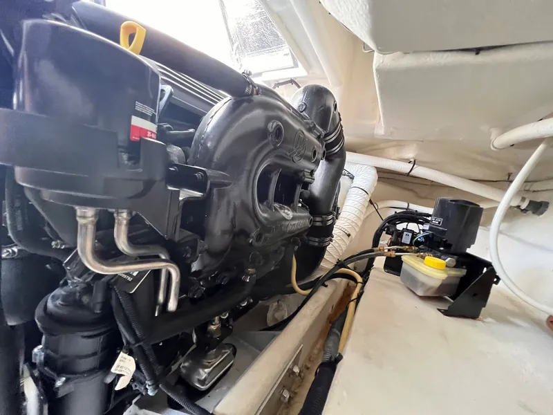 Slide: The Image of Engine compartment of 2019 Cruisers Yachts 338 CX South Beach Bow Rider. - 36