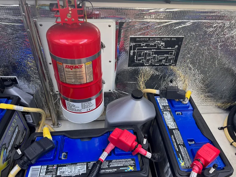 Slide: The Image of Battery and fire extinguisher setup in 2019 Cruisers Yachts 338 CX. - 38