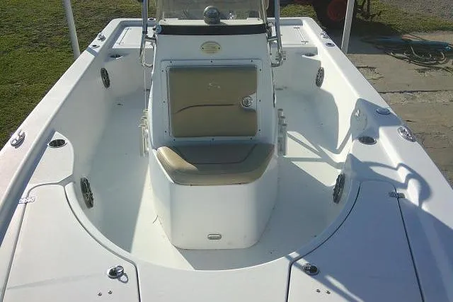 Slide: The Image of 2017 Sportsman Masters 207 Bay Boat interior, featuring center console and seating. - 17