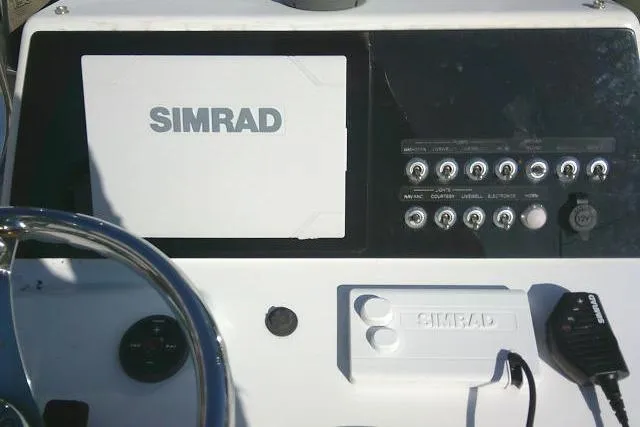 Slide: The Image of Control panel of a 2017 Sportsman Masters 207 Bay Boat with Simrad electronics. - 23