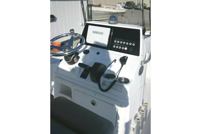 Slide: The Image of Control panel of a 2017 Sportsman Masters 207 Bay Boat with Simrad display. - 25