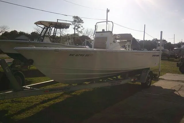 Slide: The Image of 2017 Sportsman Masters 207 Bay Boat on trailer, parked outdoors in sunlight. - 5
