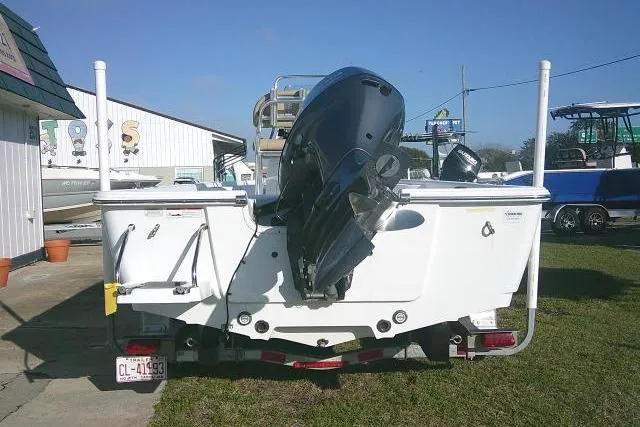 Slide: The Image of 2017 Sportsman Masters 207 Bay Boat with outboard motor, parked on trailer. - 8