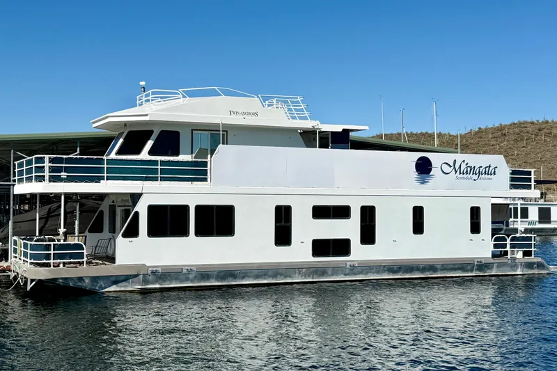 The Image of 2005 Twin Anchors 6816 Arizona Edition Yacht House on water, clear sky background. - 0