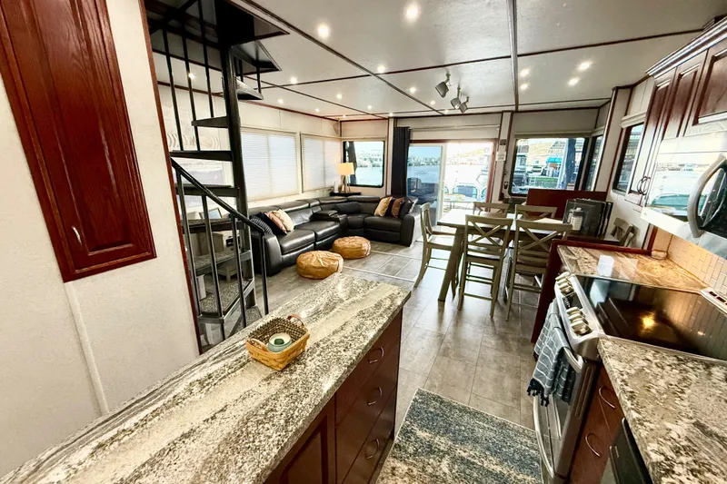 Slide: The Image of Luxurious interior of 2005 Twin Anchors 6816 Arizona Edition Yacht House, featuring modern kitchen and seating area. - 13