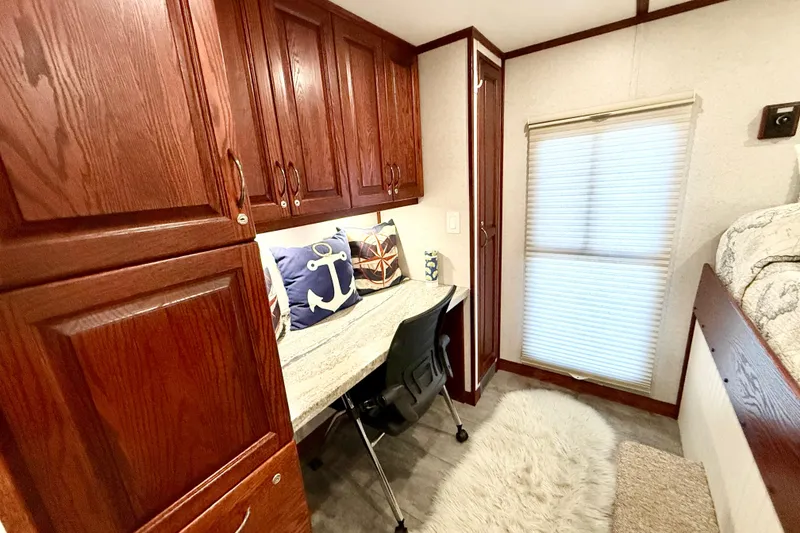 Slide: The Image of Cozy interior of 2005 Twin Anchors Yacht House with wooden cabinets and nautical decor. - 18