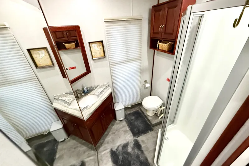 Slide: The Image of Luxurious bathroom in 2005 Twin Anchors Yacht House, featuring elegant fixtures and ample storage. - 20