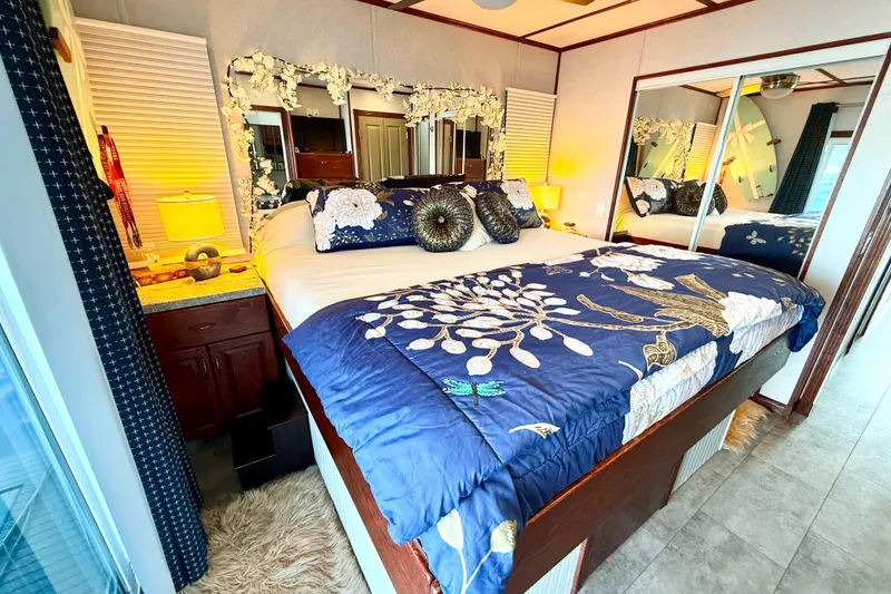 Slide: The Image of Luxurious bedroom in 2005 Twin Anchors 6816 Arizona Edition Yacht House with floral decor. - 23