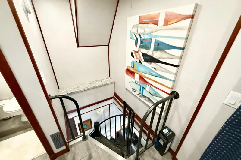 Slide: The Image of Staircase in 2005 Twin Anchors Yacht House with colorful paddle artwork. - 38