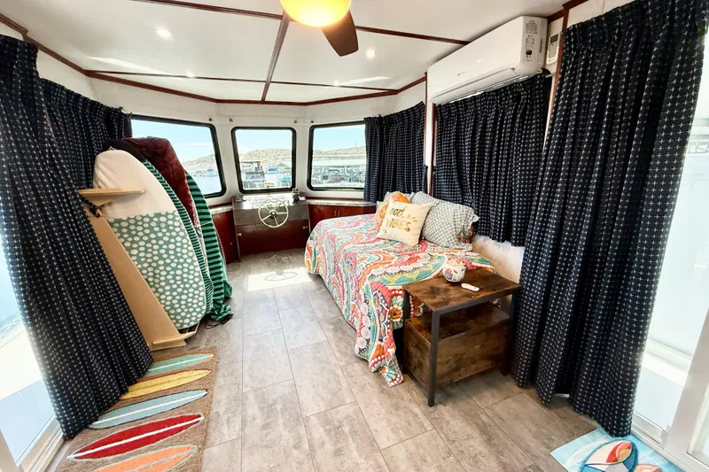 Slide: The Image of Interior of 2005 Twin Anchors Yacht House with colorful decor and surfboards. - 41