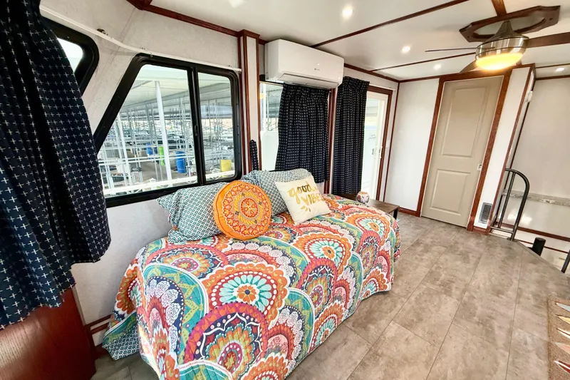 Slide: The Image of Interior of 2005 Twin Anchors Yacht House with colorful decor and modern furnishings. - 42