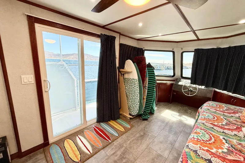 Slide: The Image of Interior of 2005 Twin Anchors Yacht House with surfboards and lake view. - 43