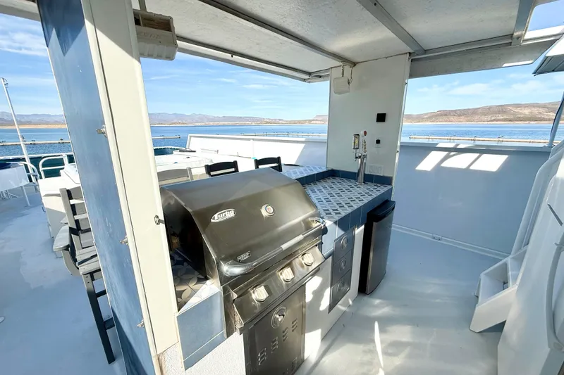 Slide: The Image of Outdoor kitchen on 2005 Twin Anchors 6816 Arizona Edition Yacht House with scenic water view. - 49