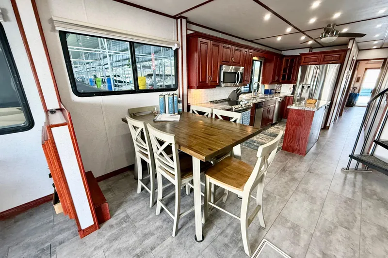 Slide: The Image of Luxurious kitchen interior of 2005 Twin Anchors Yacht House, featuring modern appliances and elegant dining area. - 5