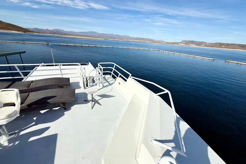 Slide: The Image of Upper deck of 2005 Twin Anchors 6816 Arizona Edition Yacht House on serene lake. - 52