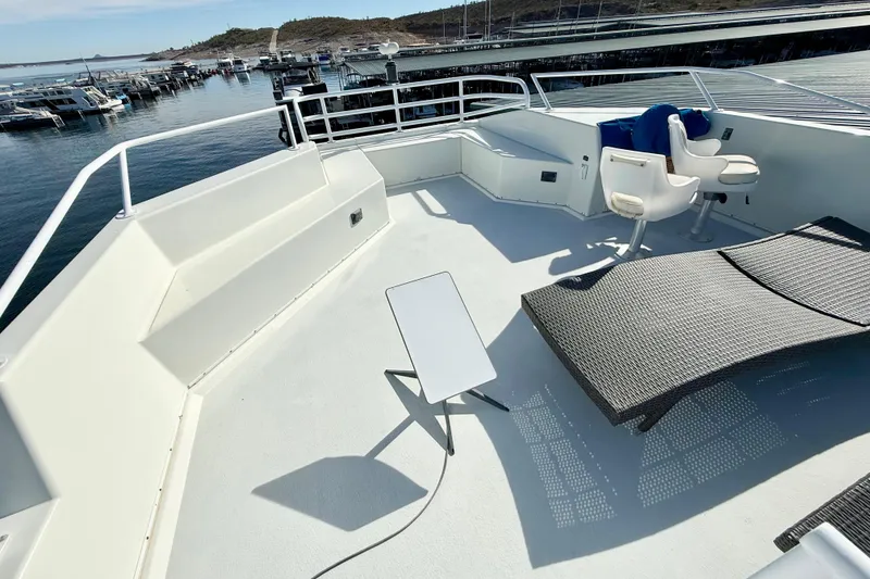 Slide: The Image of Spacious deck of 2005 Twin Anchors 6816 Arizona Edition Yacht House with seating and table. - 54