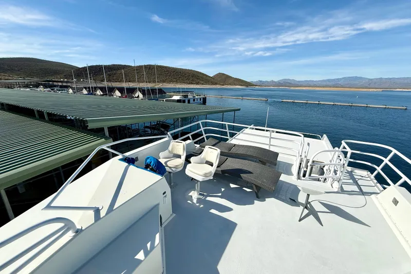 Slide: The Image of Rooftop deck of 2005 Twin Anchors 6816 Arizona Edition Yacht House, overlooking serene marina. - 56