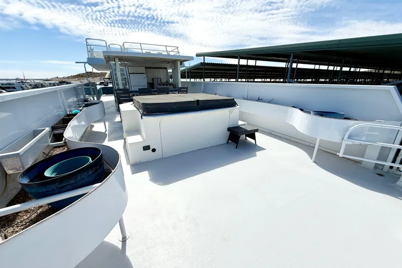 Slide: The Image of 2005 Twin Anchors 6816 Arizona Edition Yacht House deck with seating and storage. - 64