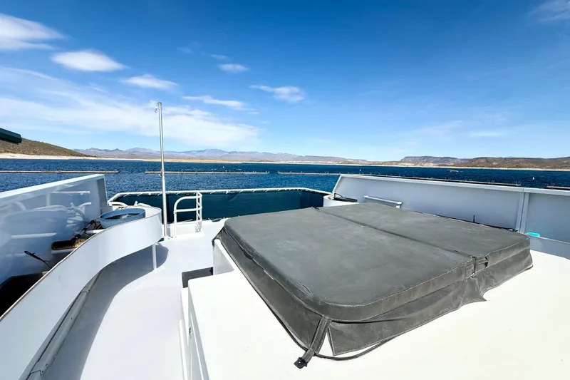 Slide: The Image of 2005 Twin Anchors 6816 Arizona Edition Yacht House on serene lake with clear blue sky. - 65