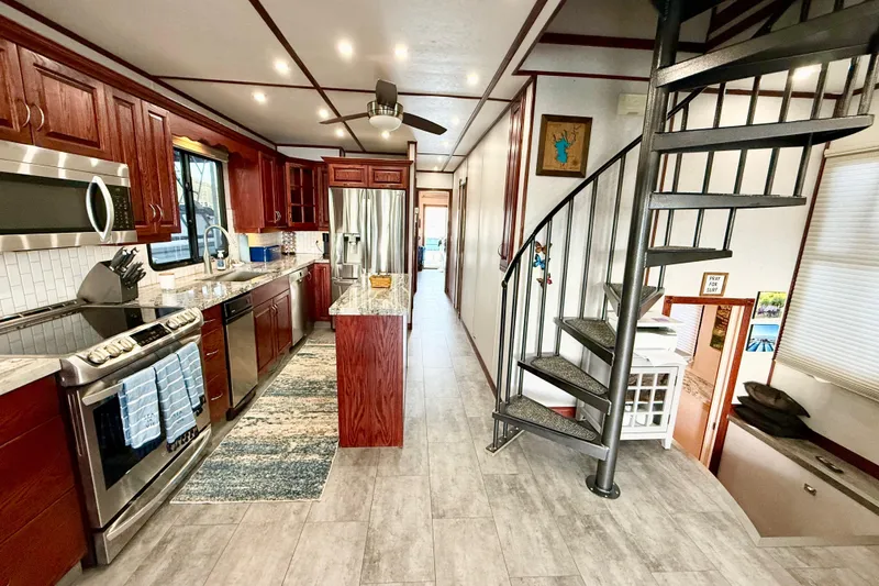 Slide: The Image of Luxurious kitchen interior of 2005 Twin Anchors 6816 Arizona Edition Yacht House. - 7