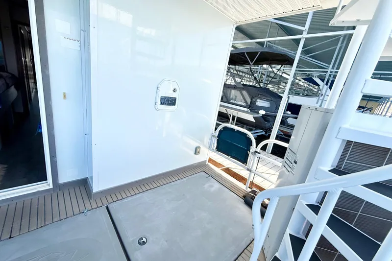 Slide: The Image of 2005 Twin Anchors 6816 Arizona Edition Yacht House interior with dock view and spiral staircase. - 71