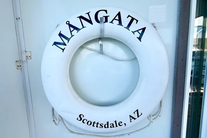 Slide: The Image of Life preserver on Twin Anchors 6816 Yacht House, labeled "Mångata, Scottsdale, AZ". - 72