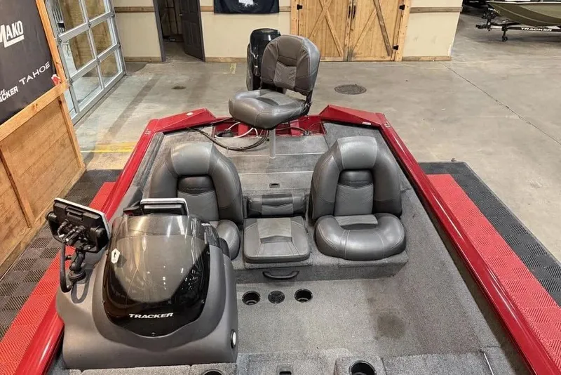 Slide: The Image of 2019 Tracker Pro Team 175 TXW boat interior with seating and control panel. - 6