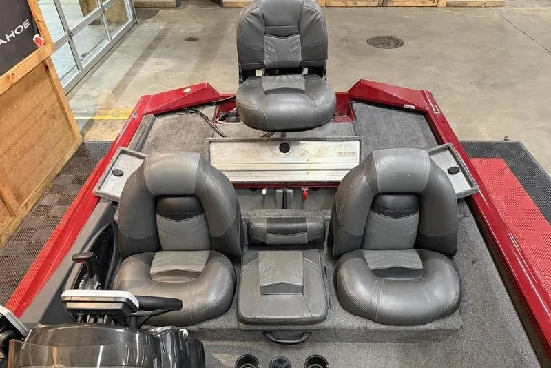 Slide: The Image of 2019 Tracker Pro Team 175 TXW boat interior with gray seating and red accents. - 8
