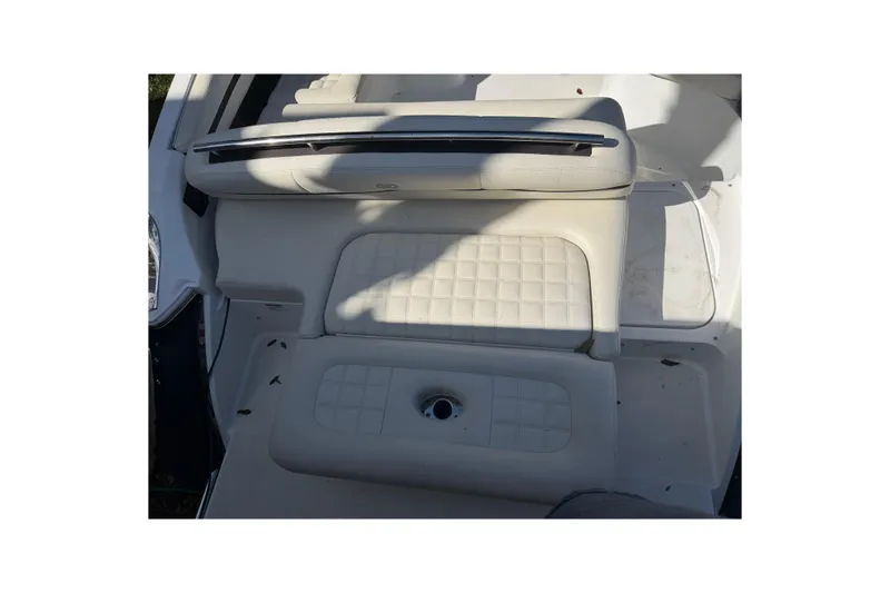 Slide: The Image of 2017 Cobalt R3 boat interior with white cushioned seating and sleek design. - 11