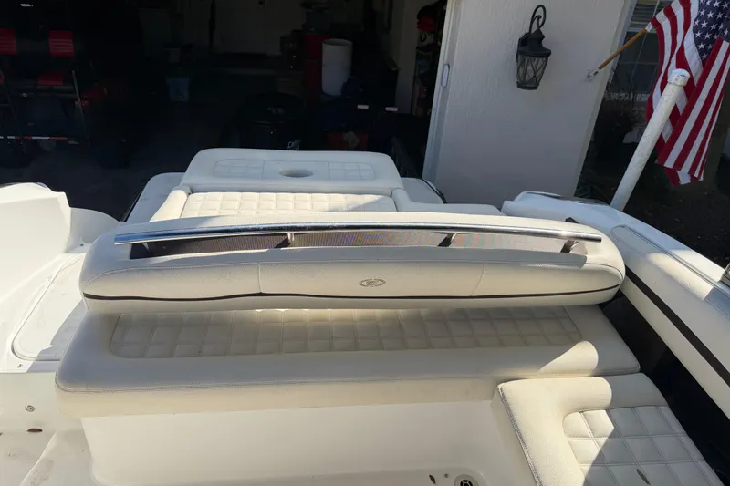 Slide: The Image of 2017 Cobalt R3 boat interior with cushioned seating and American flag. - 13