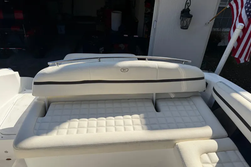 Slide: The Image of 2017 Cobalt R3 boat with white cushioned seating and American flag in background. - 14