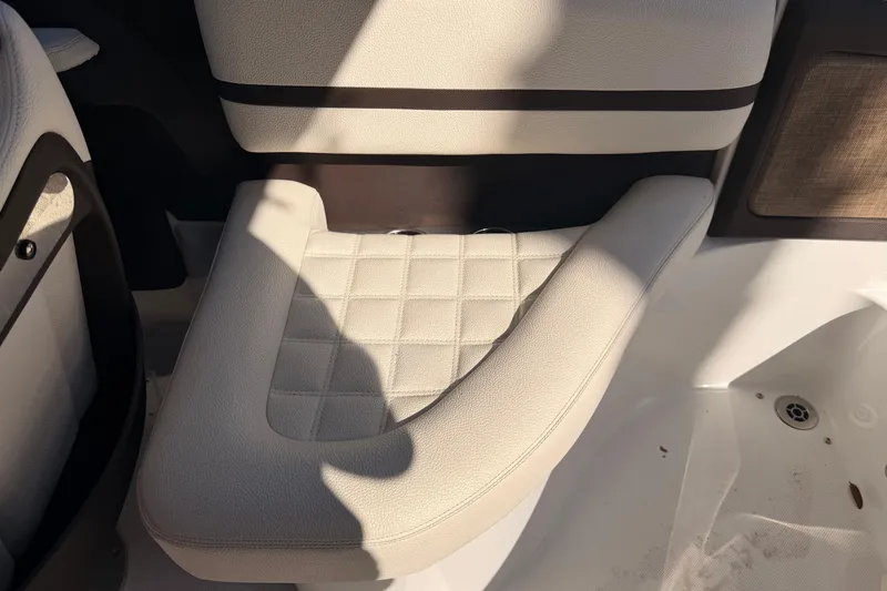 Slide: The Image of 2017 Cobalt R3 boat interior with beige cushioned seating. - 16