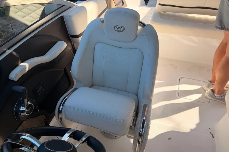 Slide: The Image of 2017 Cobalt R3 boat interior with white captain's chair and steering wheel. - 19