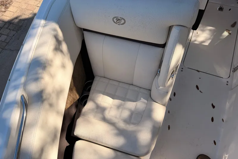 Slide: The Image of 2017 Cobalt R3 boat interior with white leather seating and cup holders. - 32